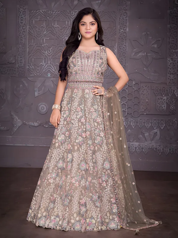 Beige net lehenga choli with diamond embellishments