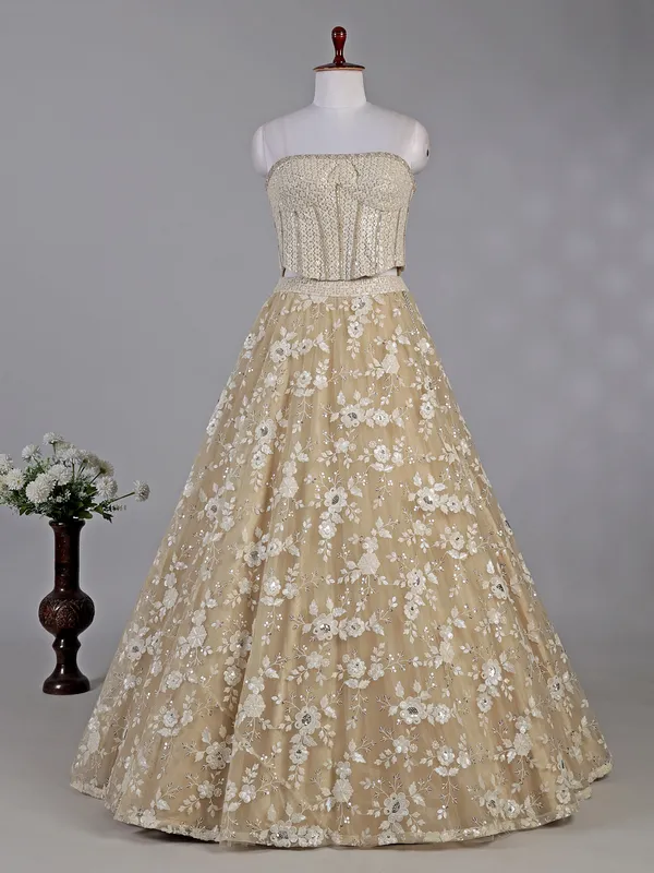 Beige net lehenga choli with sequins work