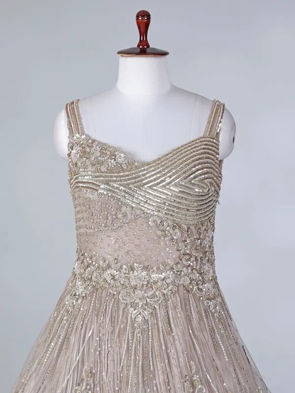 Beige net sleeveless sweetheart designer floor length gown