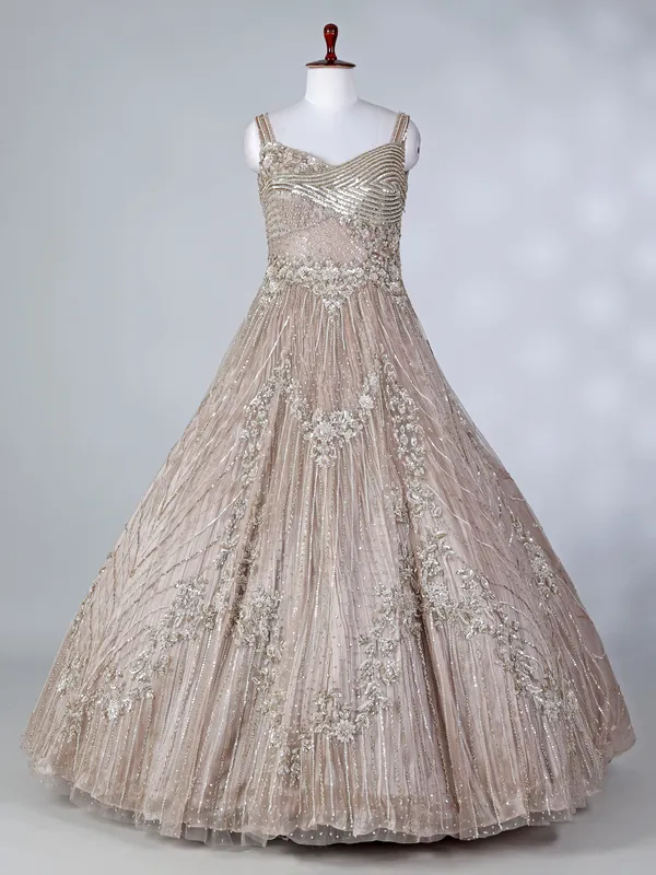 Beige net sleeveless sweetheart designer floor length gown