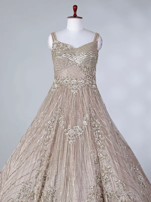 Beige net sleeveless sweetheart designer floor length gown