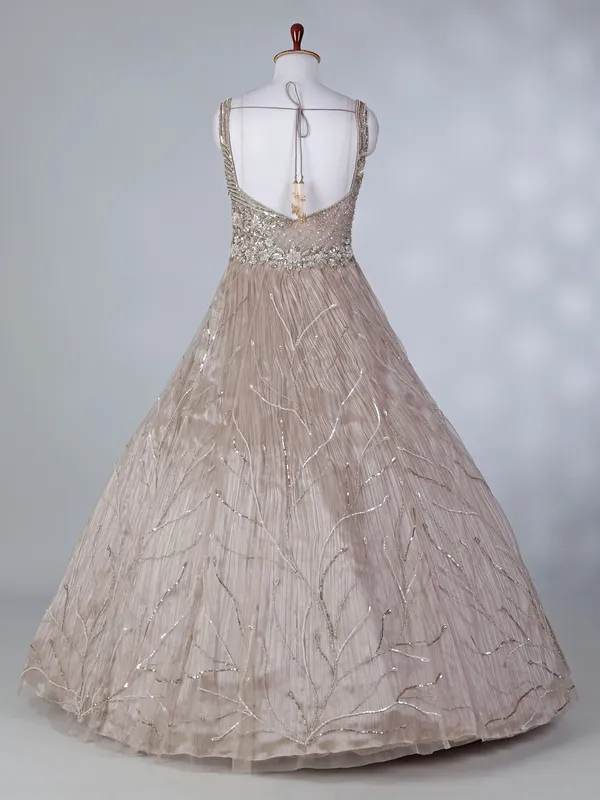 Beige net sleeveless sweetheart designer floor length gown