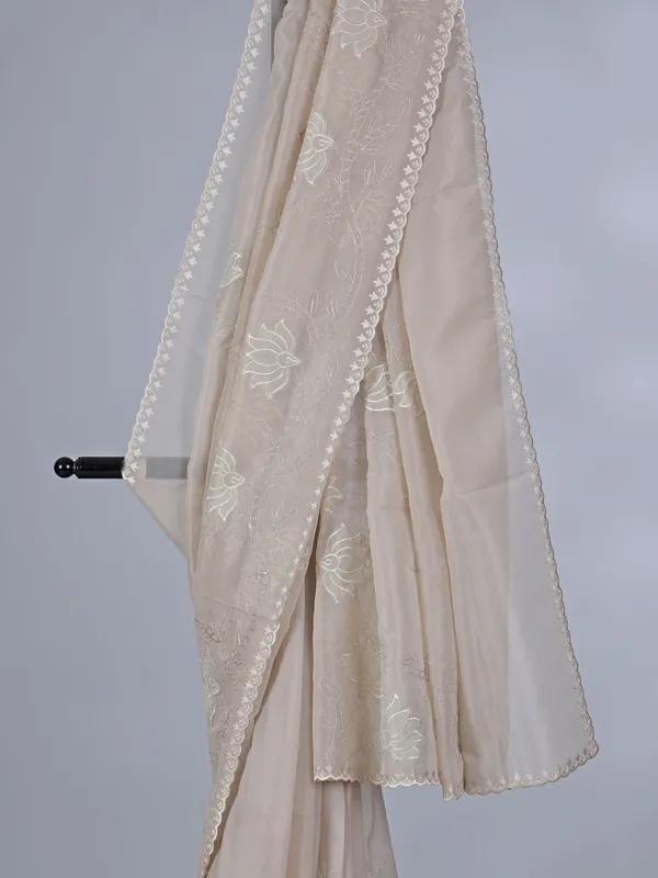 Beige organza saree with subtle resham and embroidery work