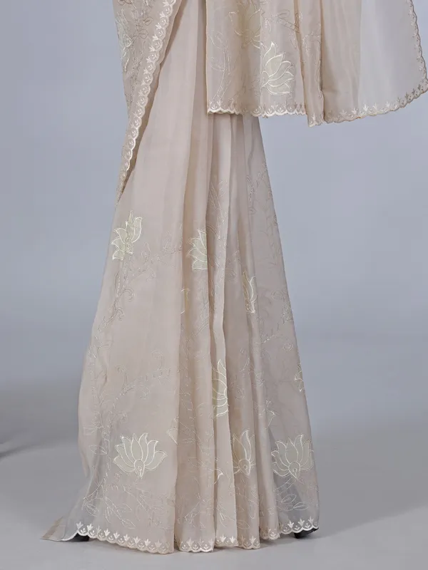 Beige organza saree with subtle resham and embroidery work