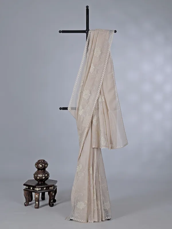 Beige organza saree with subtle resham and embroidery work