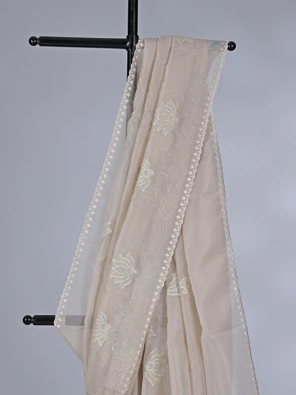 Beige organza saree with subtle resham and embroidery work