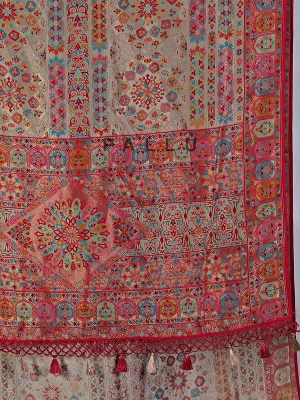Beige pashmina silk saree with colorful motifs