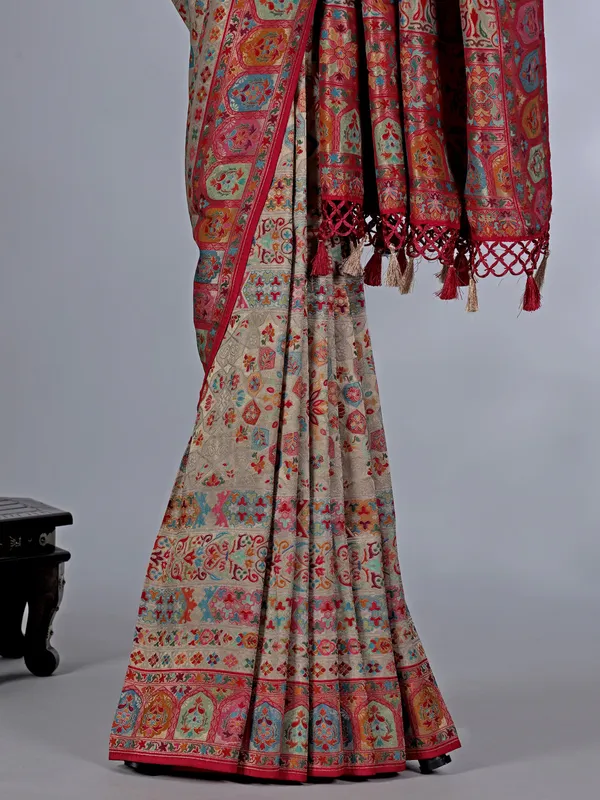 Beige pashmina silk saree with colorful motifs