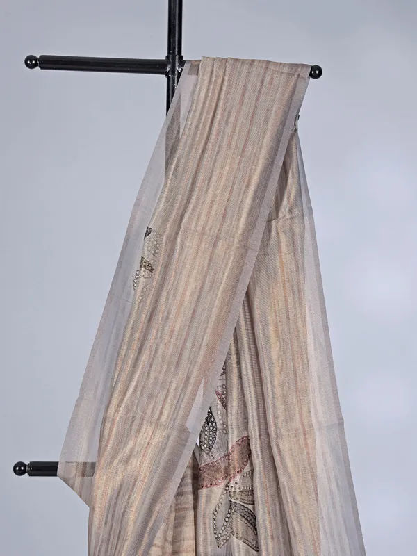 Beige printed organza saree with zari detailing