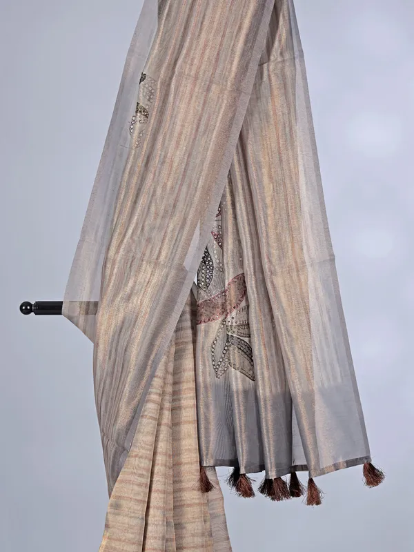 Beige printed organza saree with zari detailing