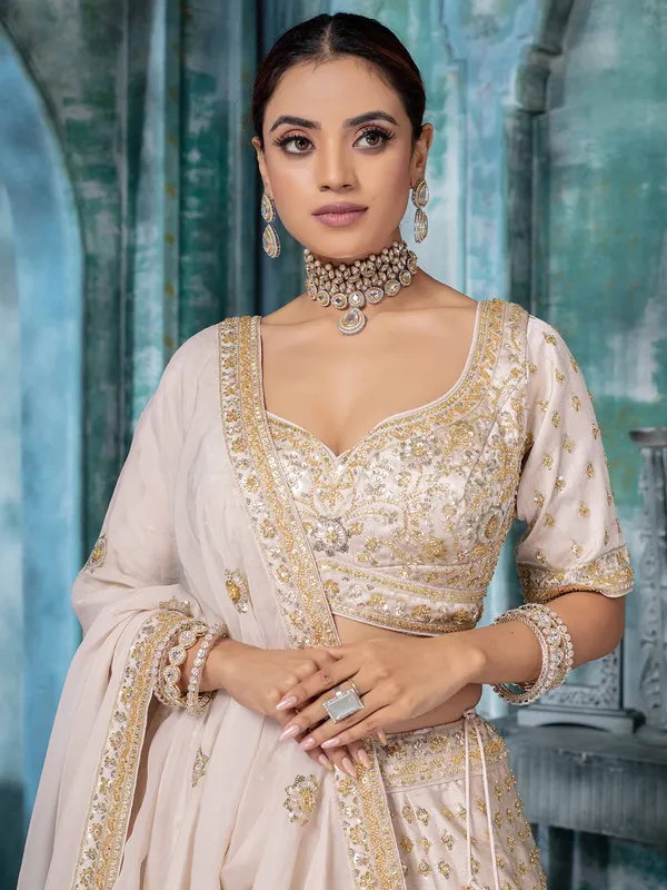 Beige raw silk bridal lehenga choli with beads