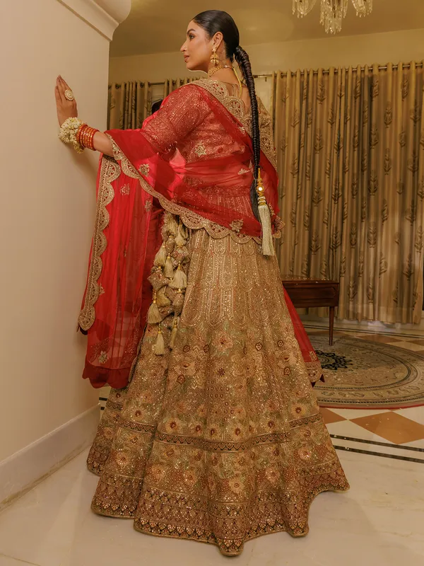 Beige silk bridal lehenga choli with red dupatta