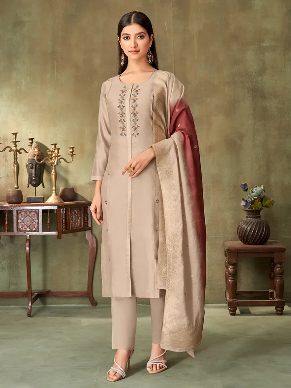 Beige silk embroidered straight cut salwar suit with dupatta