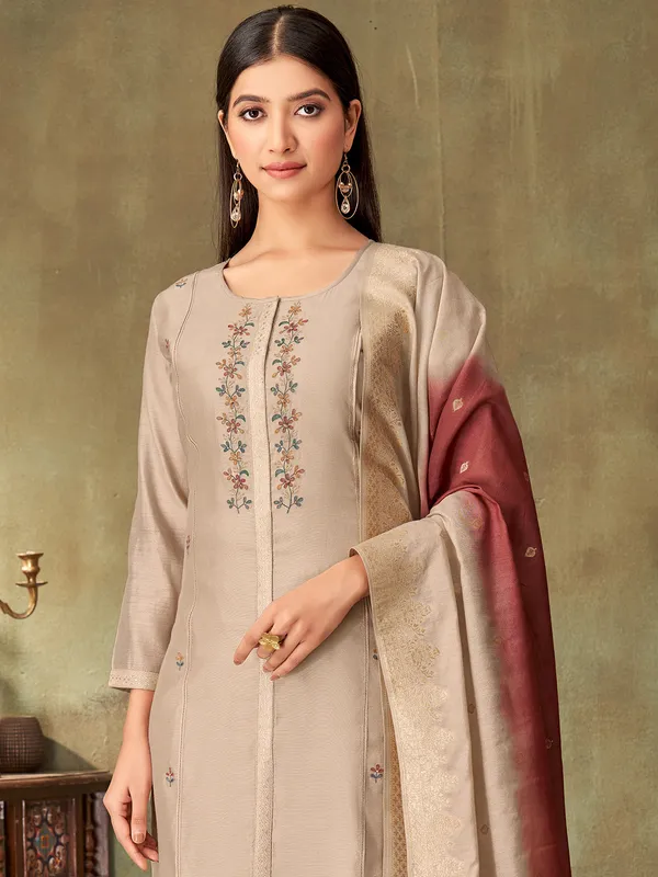 Beige silk embroidered straight cut salwar suit with dupatta