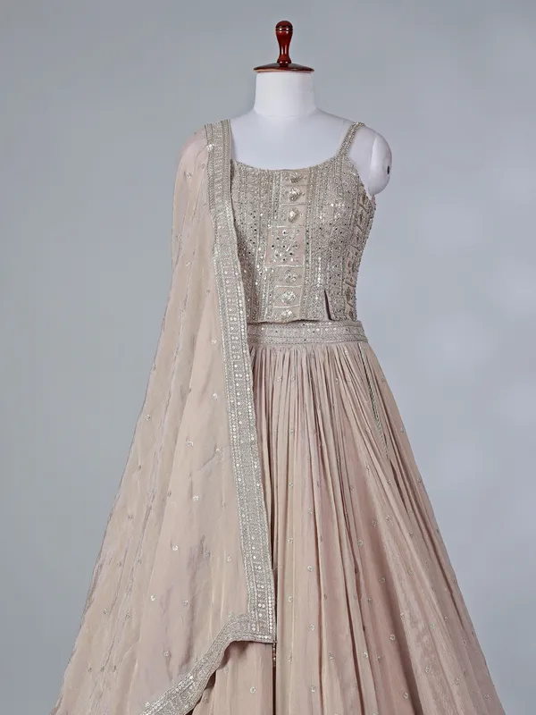 Beige silk lehenga choli with mirror embellishments