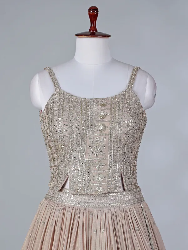 Beige silk lehenga choli with mirror embellishments