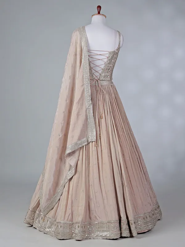 Beige silk lehenga choli with mirror embellishments