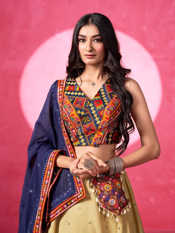 Beige silk navratri lehenga choli with V neck choli