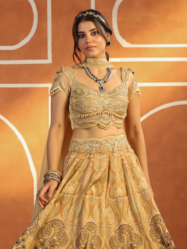 Beige silk printed lehenga choli with rich embellished choli