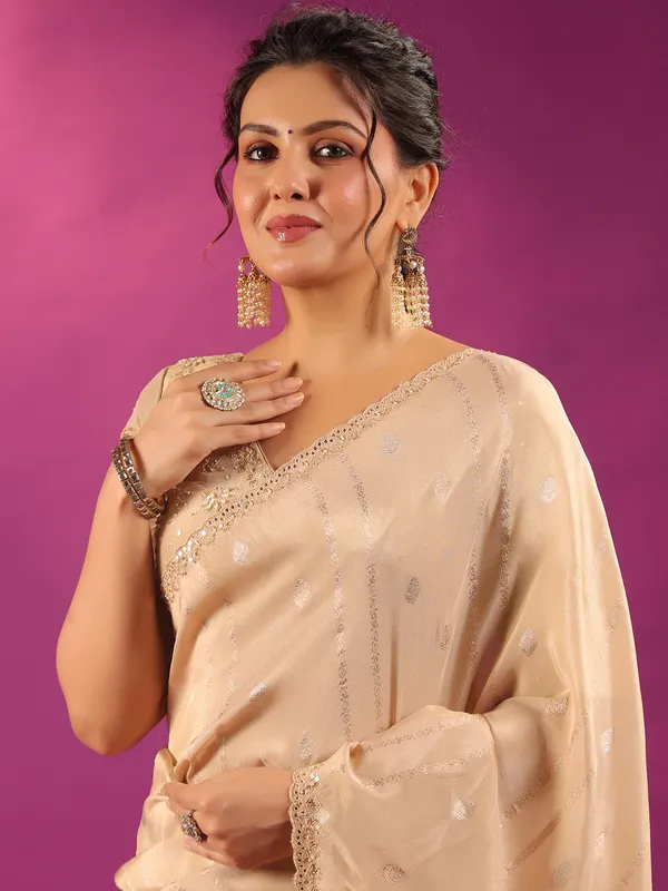 Beige silk saree for festive celebration
