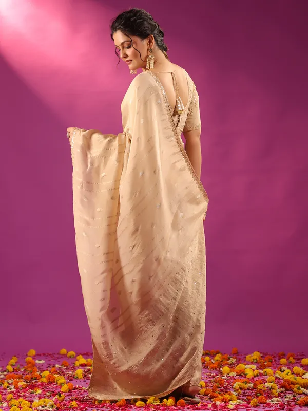 Beige silk saree for festive celebration