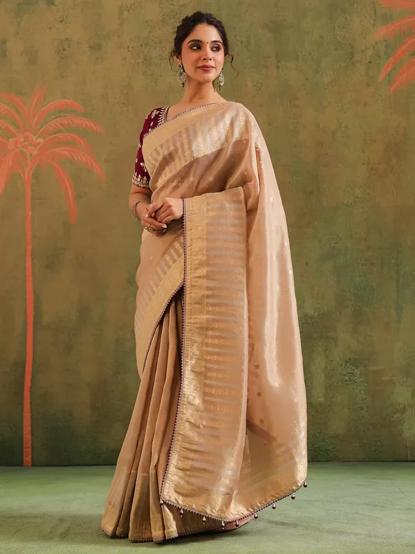Beige silk saree with bold blouse