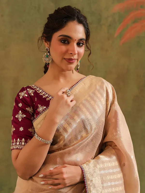 Beige silk saree with bold blouse