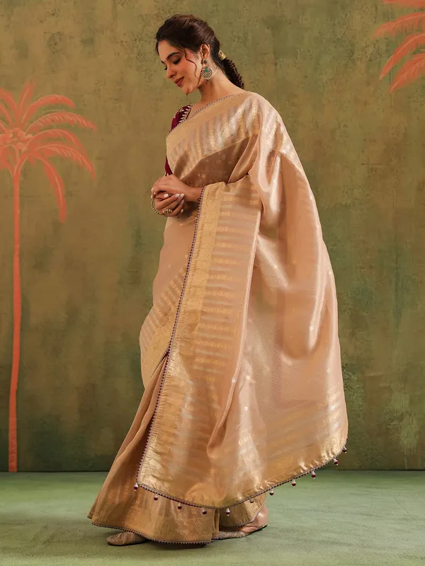 Beige silk saree with bold blouse