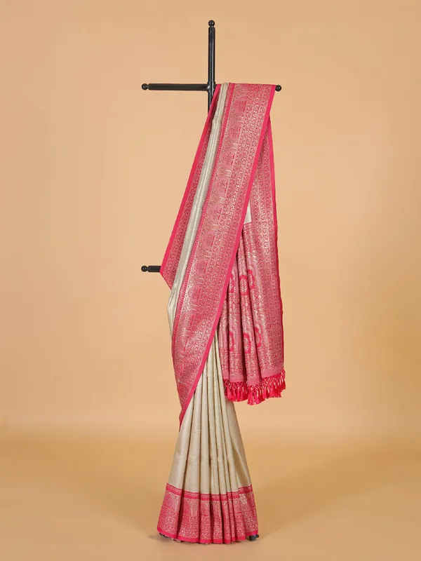 Beige silk saree with bold pink border