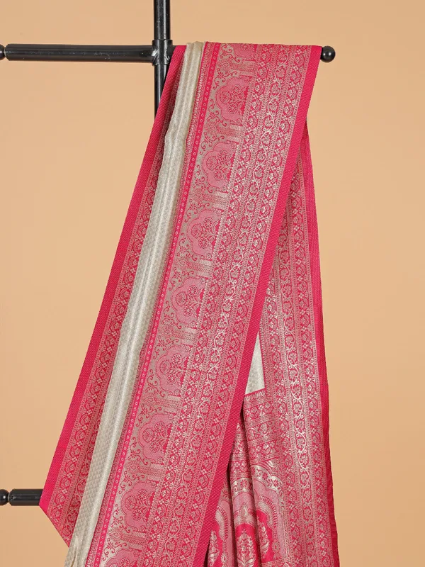 Beige silk saree with bold pink border