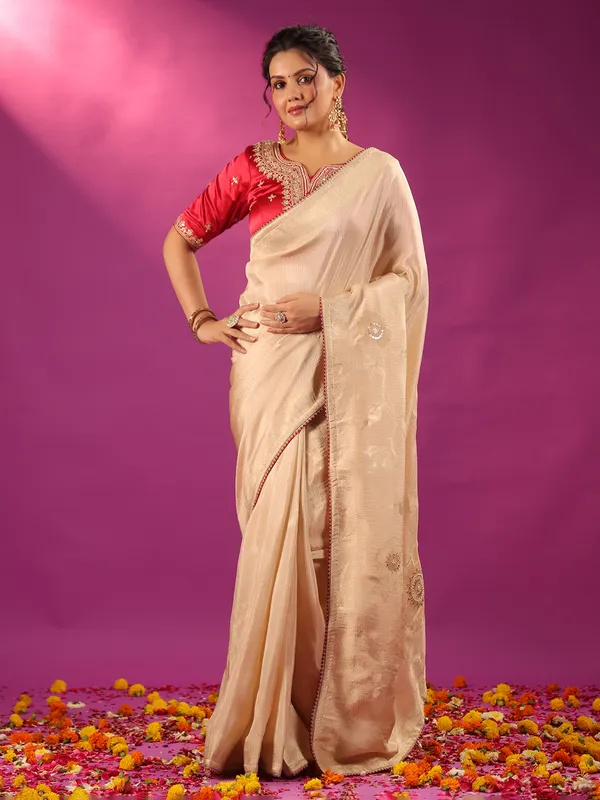 Beige silk saree with bold red blouse
