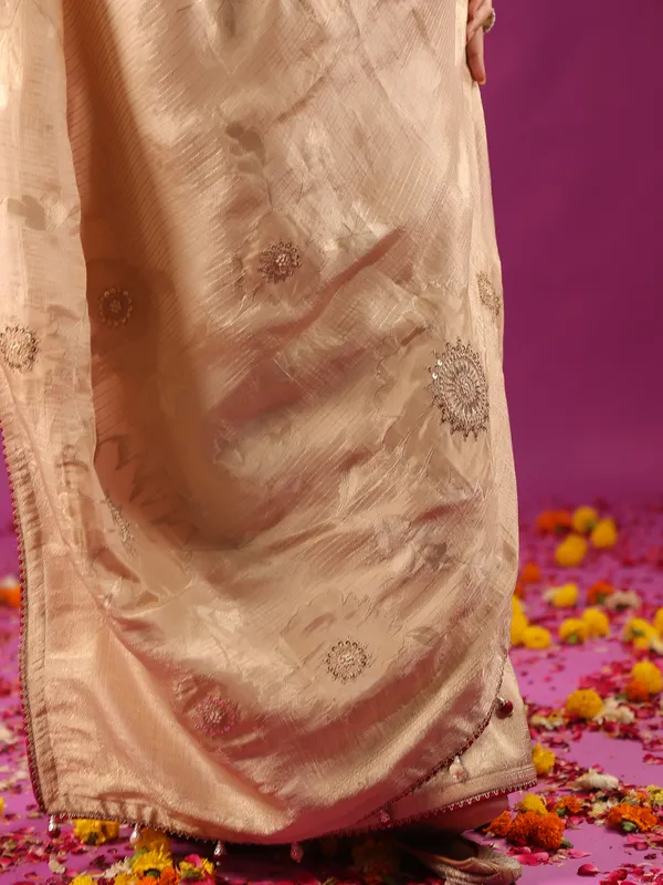 Beige silk saree with bold red blouse