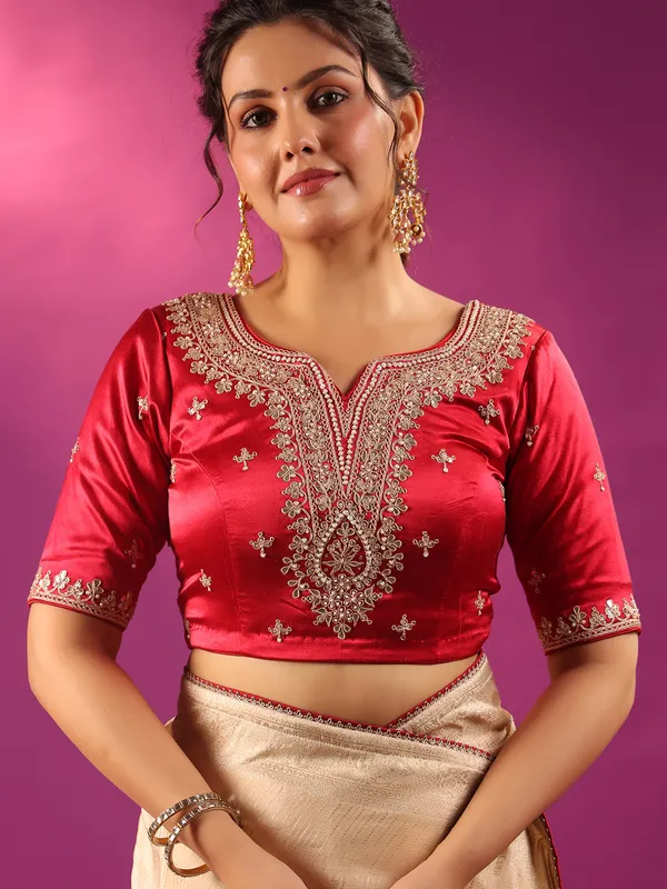 Beige silk saree with bold red blouse
