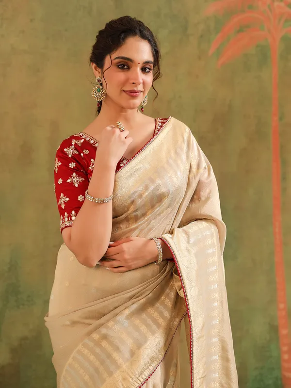 Beige silk saree with maroon contrast blouse festive wear