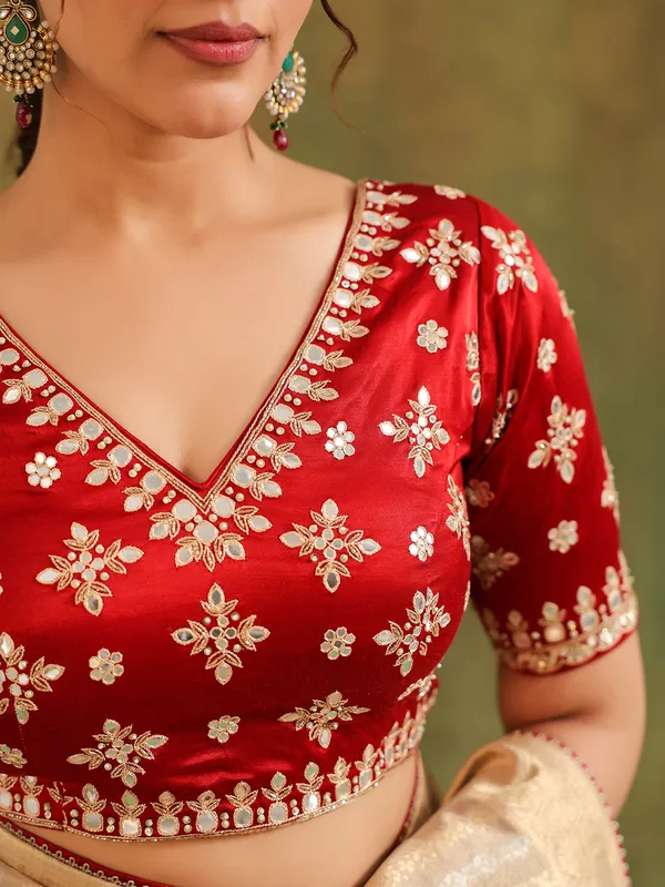 Beige silk saree with maroon contrast blouse festive wear