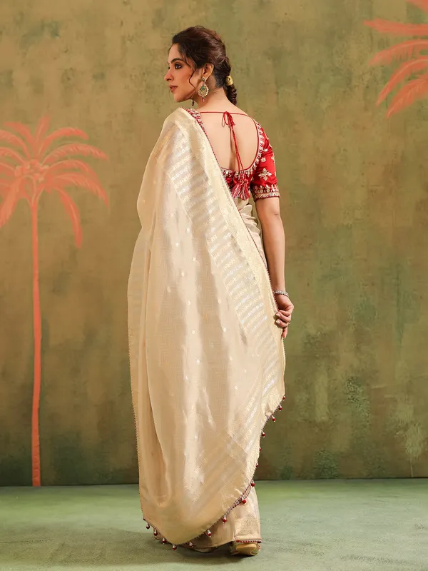 Beige silk saree with maroon contrast blouse festive wear