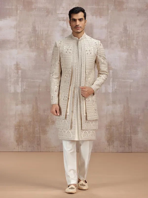 Beige silk sherwani adorned with rich resham work