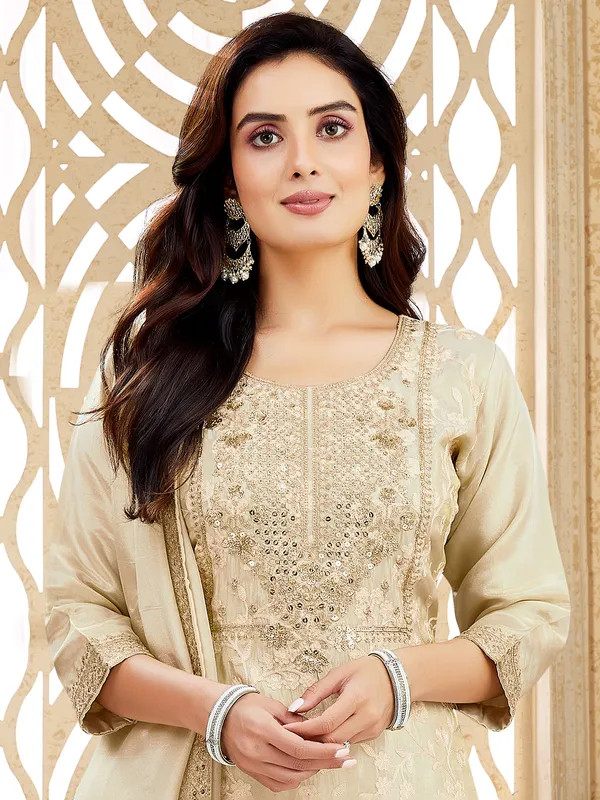 Beige silk suit with zardosi and sequin charm