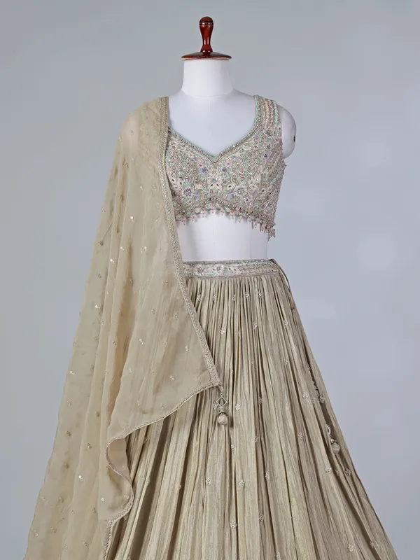 Beige silk sweetheart lehenga choli with sequins work