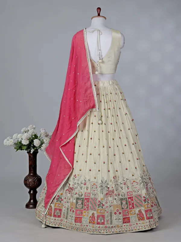 Beige silk V neck lehenga choli with contrast dupatta