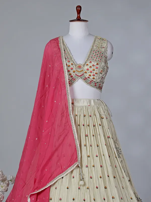 Beige silk V neck lehenga choli with contrast dupatta