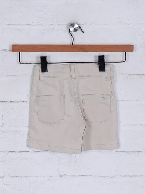 Beige solid shorts for girls
