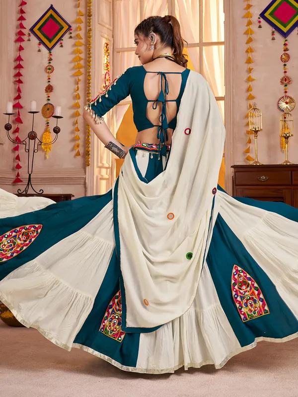 Beige teal blue enchanting navratri chaniya choli