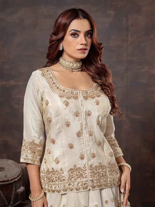 Beige tissue silk lehenga choli with round neck
