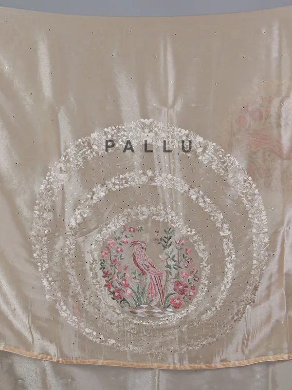 Beige tissue silk saree with birds and flowers