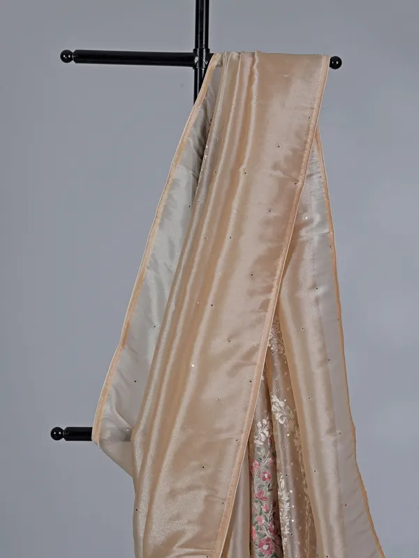 Beige tissue silk saree with birds and flowers