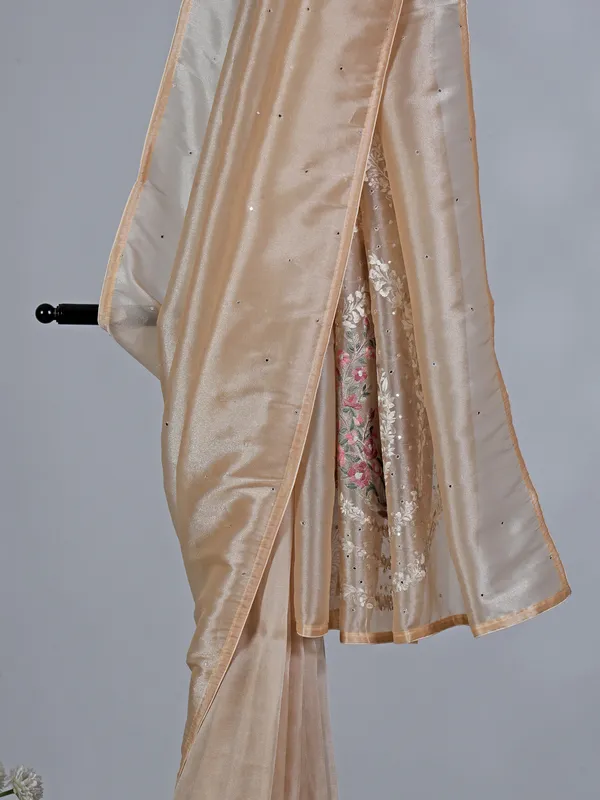 Beige tissue silk saree with birds and flowers