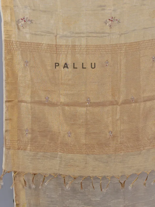 Beige tissue silk saree with cutdana work