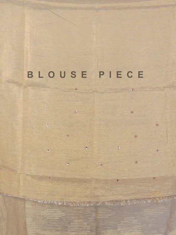 Beige tissue silk saree with cutdana work