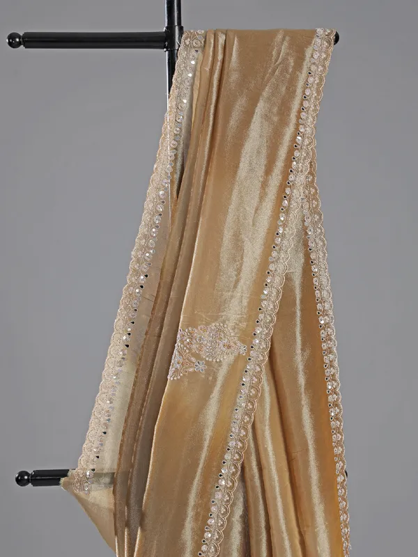 Beige tissue silk saree with embellished elegance